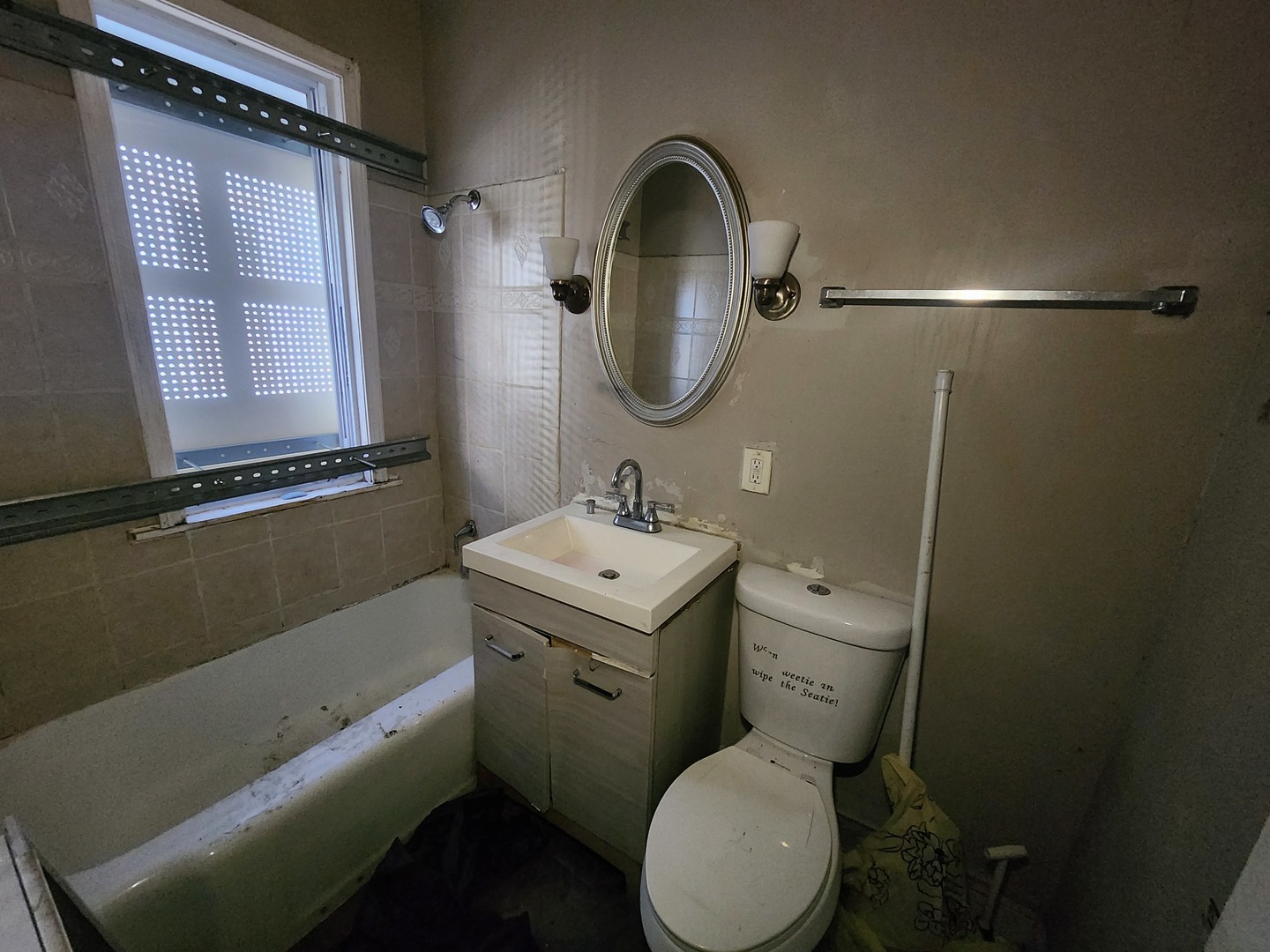 310 West 108th Place Chicago, IL 60628 - Photo 10 of 12 a bathroom with a sink toilet and shower