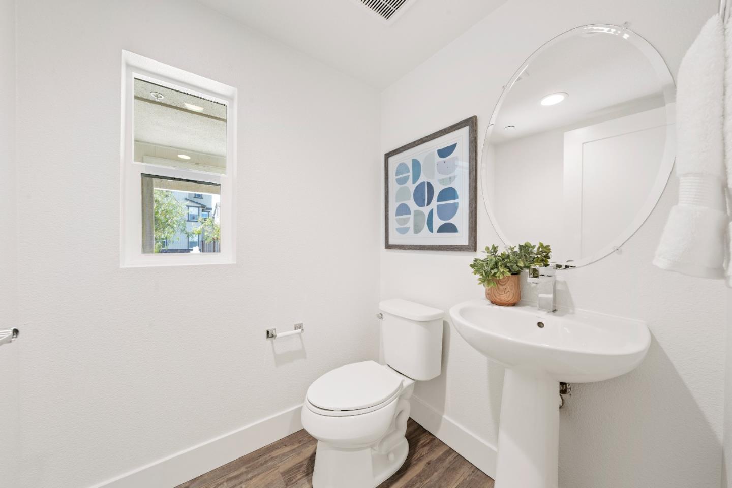 37559 Cape Cod Road Newark, CA 94560 - Photo 16 of 25 a bathroom with a toilet sink and mirror