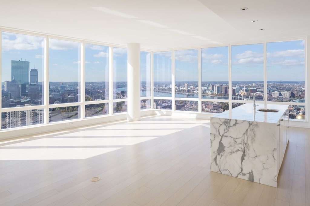 a view of a living room and a large window