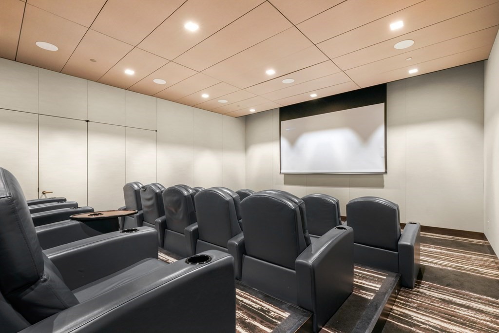 1 Franklin Street, Unit 3903 Boston, MA 02110 - Photo 18 of 26 a room with furniture and projector