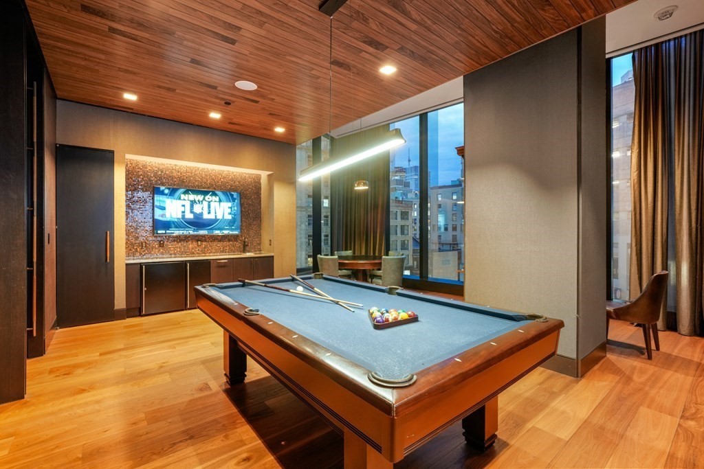 1 Franklin Street, Unit 3903 Boston, MA 02110 - Photo 20 of 26 a room with pool table and flat screen tv