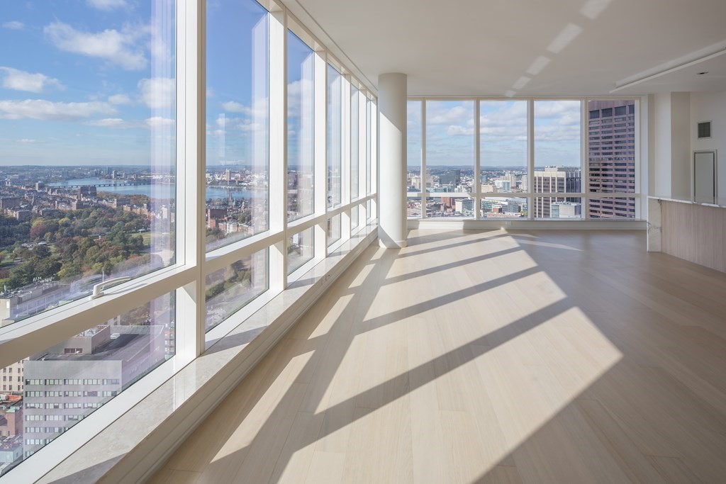 1 Franklin Street, Unit 3903 Boston, MA 02110 - Photo 2 of 26 a view of a living room and a floor to ceiling window