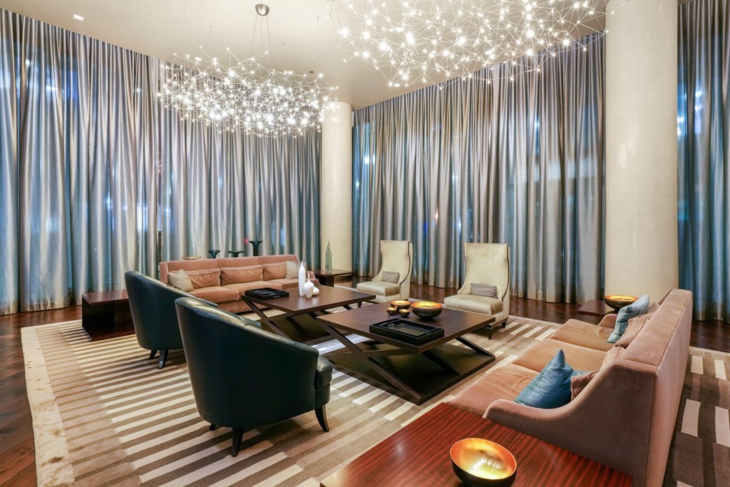 1 Franklin Street, Unit 3903 Boston, MA 02110 - Photo 23 of 26 a table with chairs and stove in it