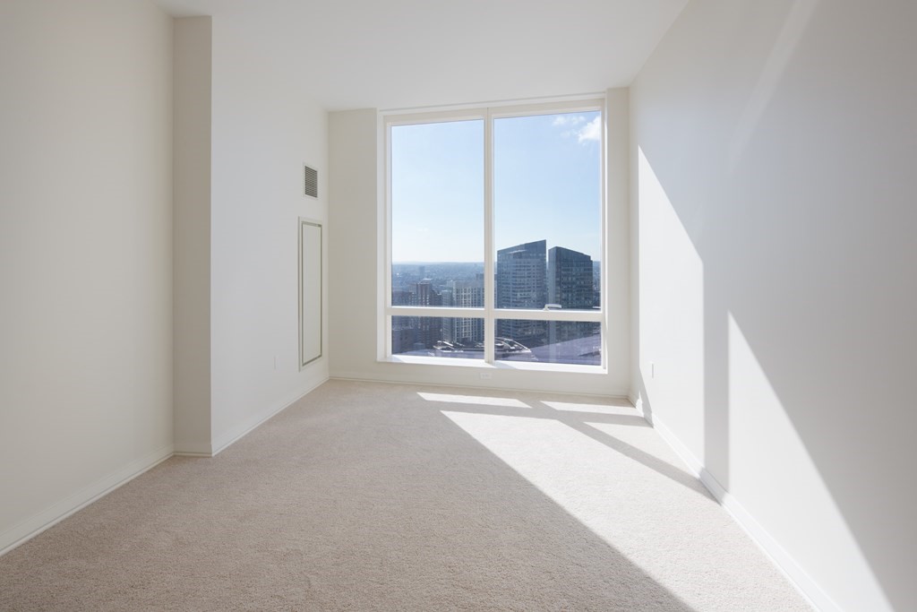 1 Franklin Street, Unit 3903 Boston, MA 02110 - Photo 7 of 26 a view of an empty room with a window