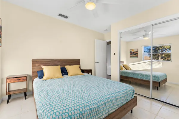 a bedroom with a bed and walk in closet