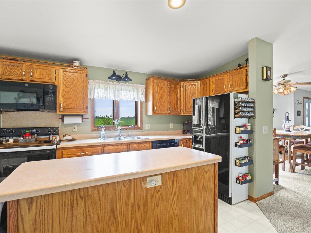 8500 Manchester Road Capron, IL 61012 - Photo 22 of 51 a kitchen with stainless steel appliances a refrigerator and a sink