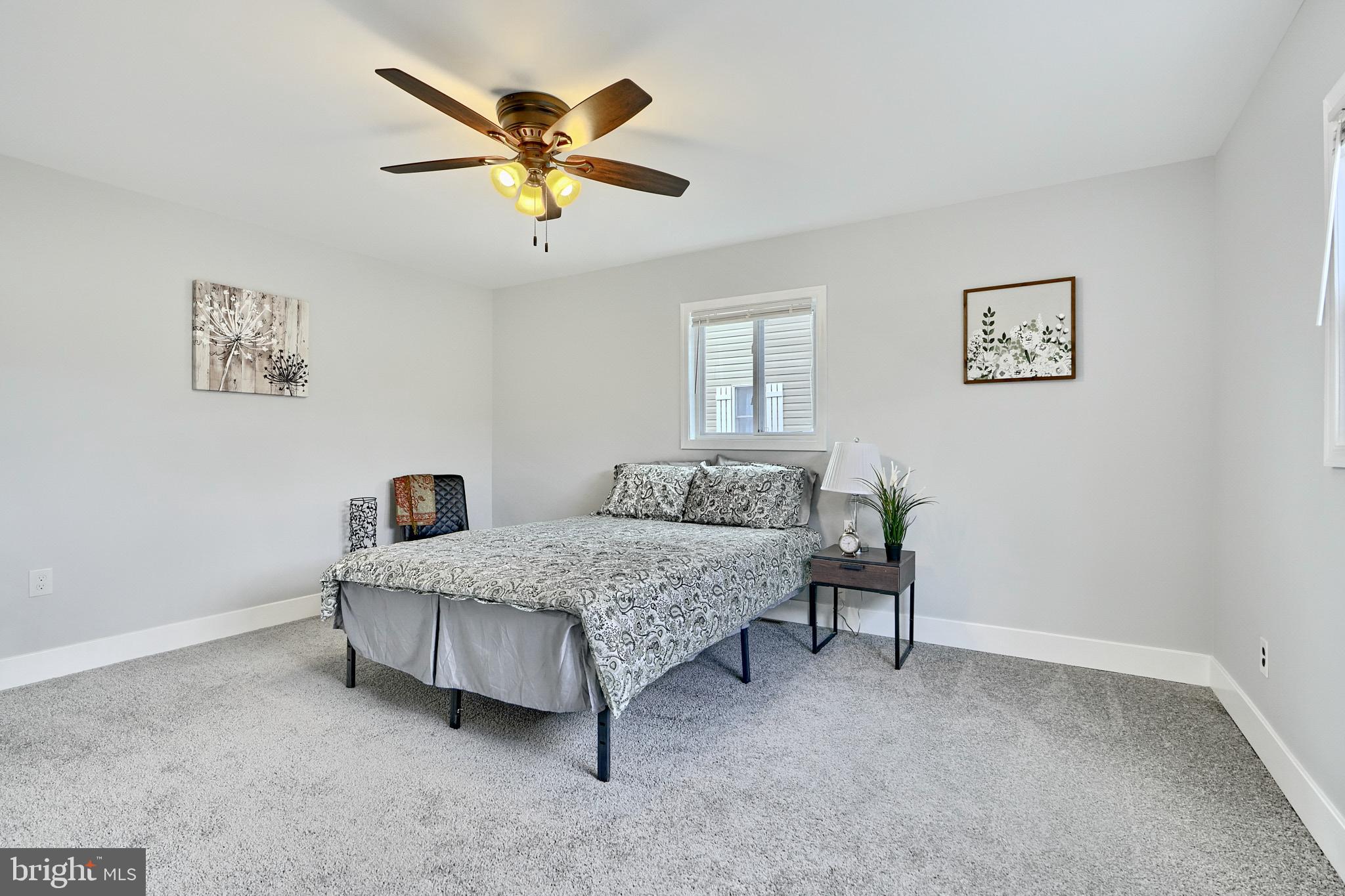 709 Fuselage Avenue Baltimore, MD 21221 - Photo 17 of 36 a bedroom with a bed and window