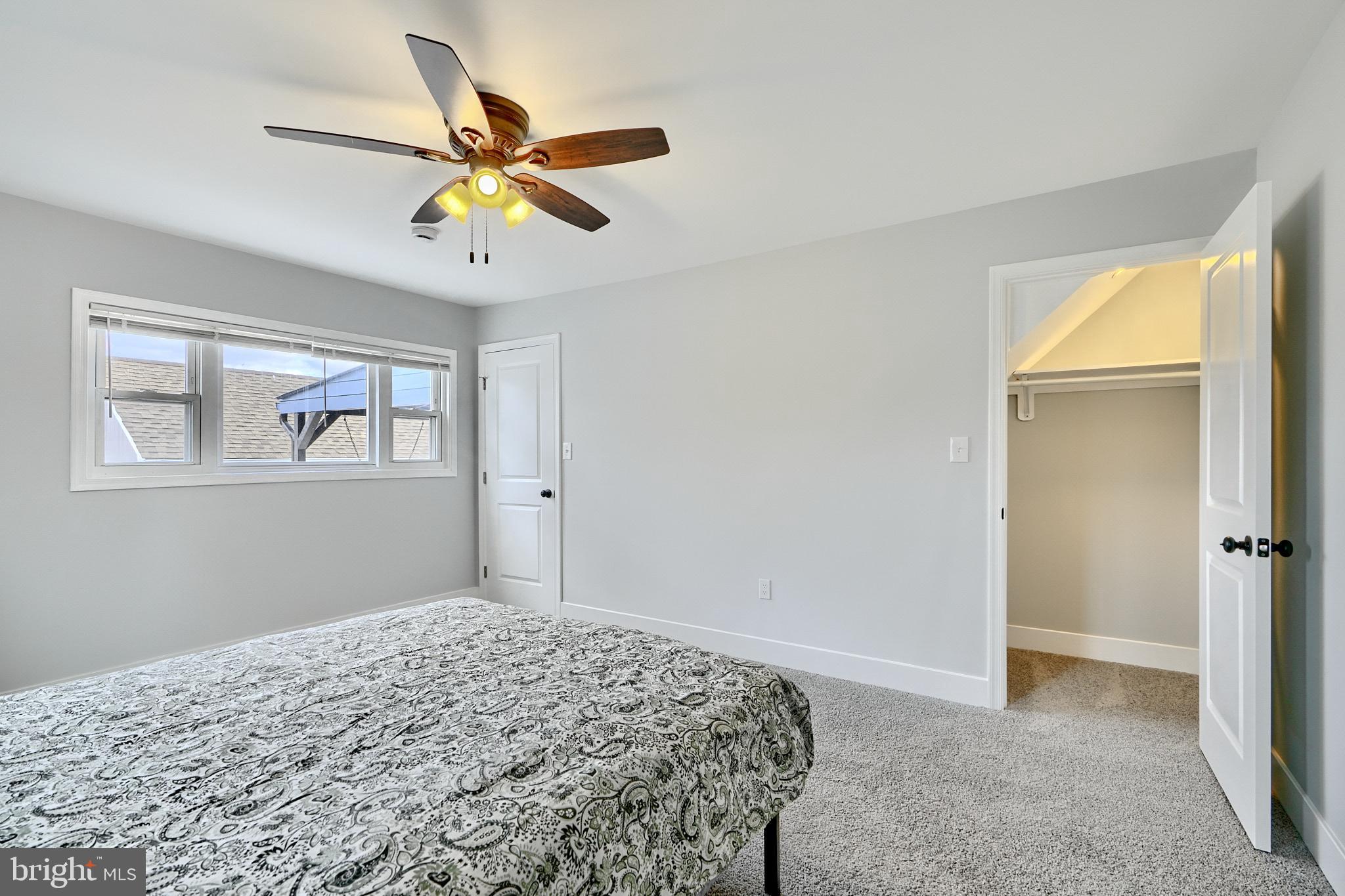 709 Fuselage Avenue Baltimore, MD 21221 - Photo 18 of 36 a bedroom with bed and a window