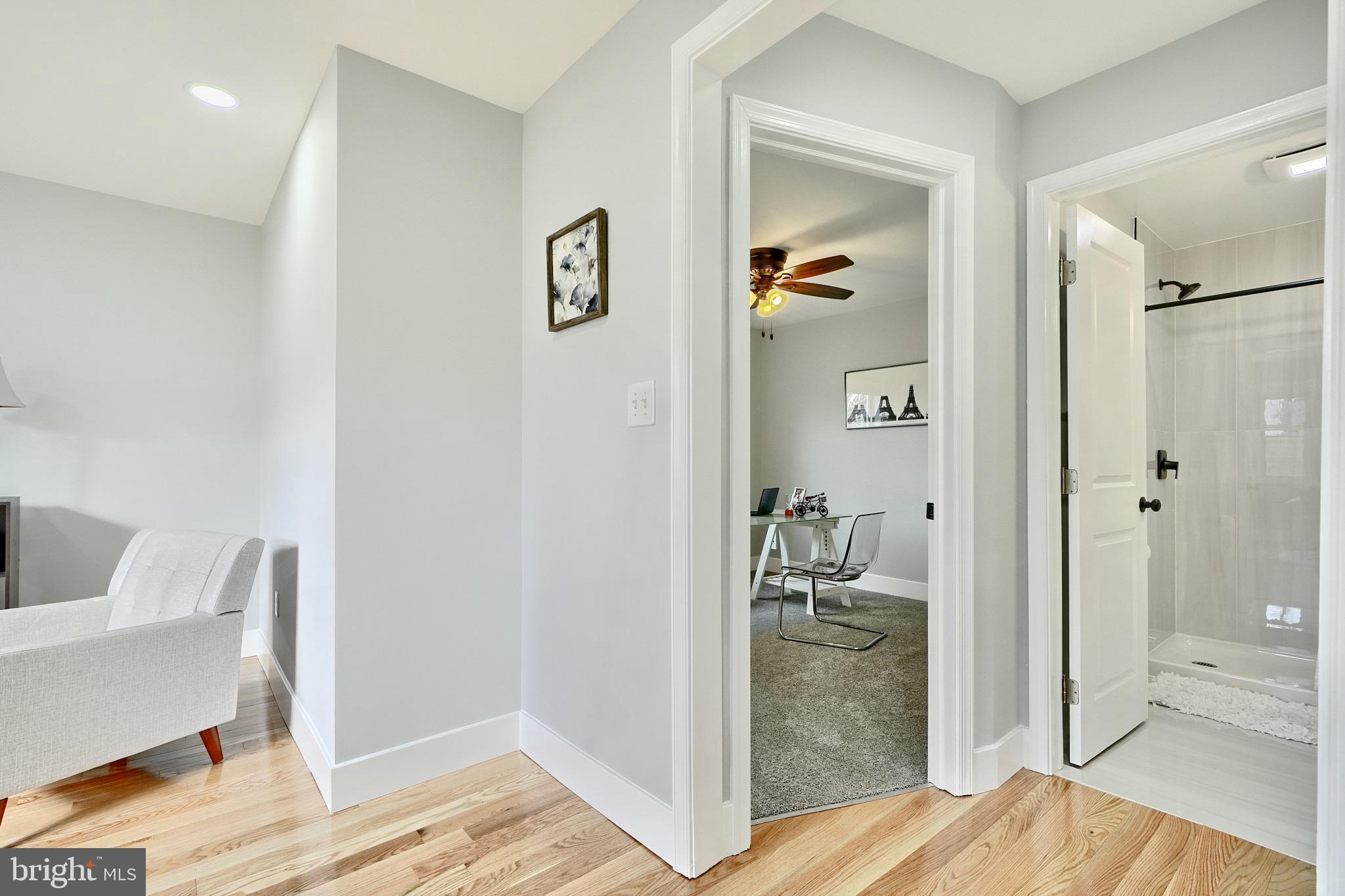 709 Fuselage Avenue Baltimore, MD 21221 - Photo 19 of 36 a view of a bedroom with wooden floor