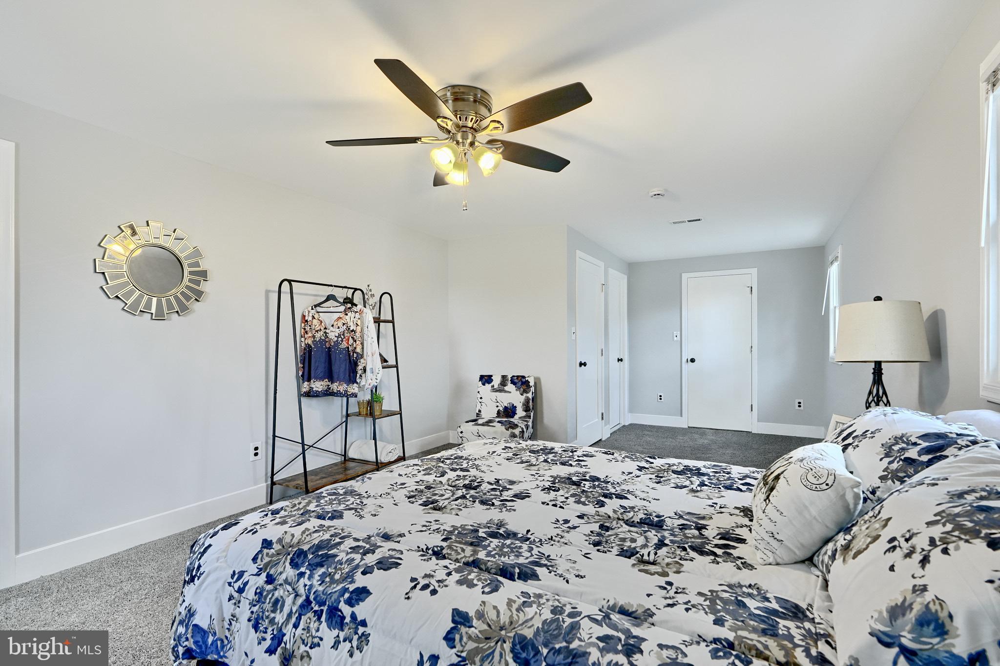 709 Fuselage Avenue Baltimore, MD 21221 - Photo 25 of 36 a bedroom with a bed and a dresser