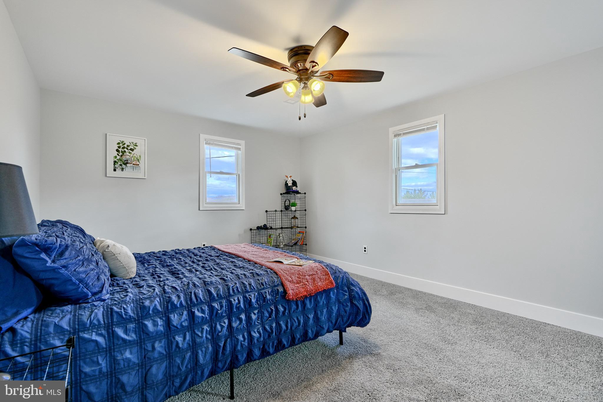 709 Fuselage Avenue Baltimore, MD 21221 - Photo 29 of 36 a bedroom with a bed and window