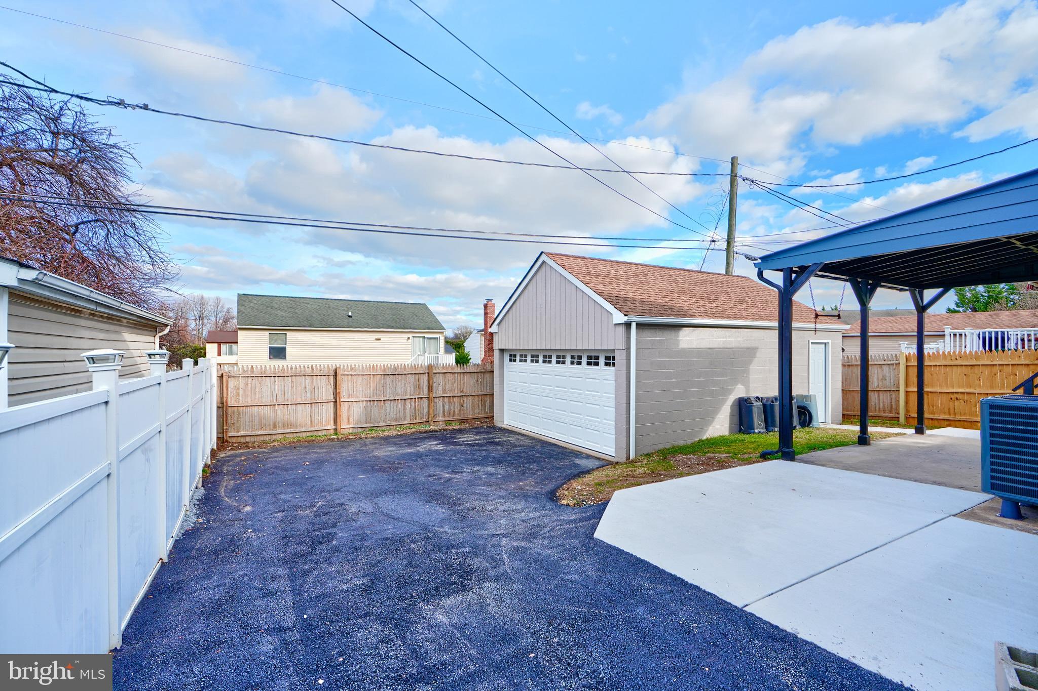 709 Fuselage Avenue Baltimore, MD 21221 - Photo 4 of 36 a view of a garage with furniture
