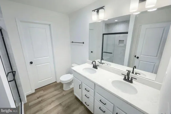 a bathroom with a shower and a bath tub