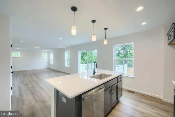 a kitchen with a stove and a sink