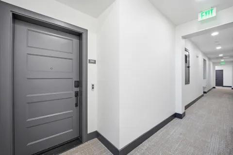 a view of a hallway with closet