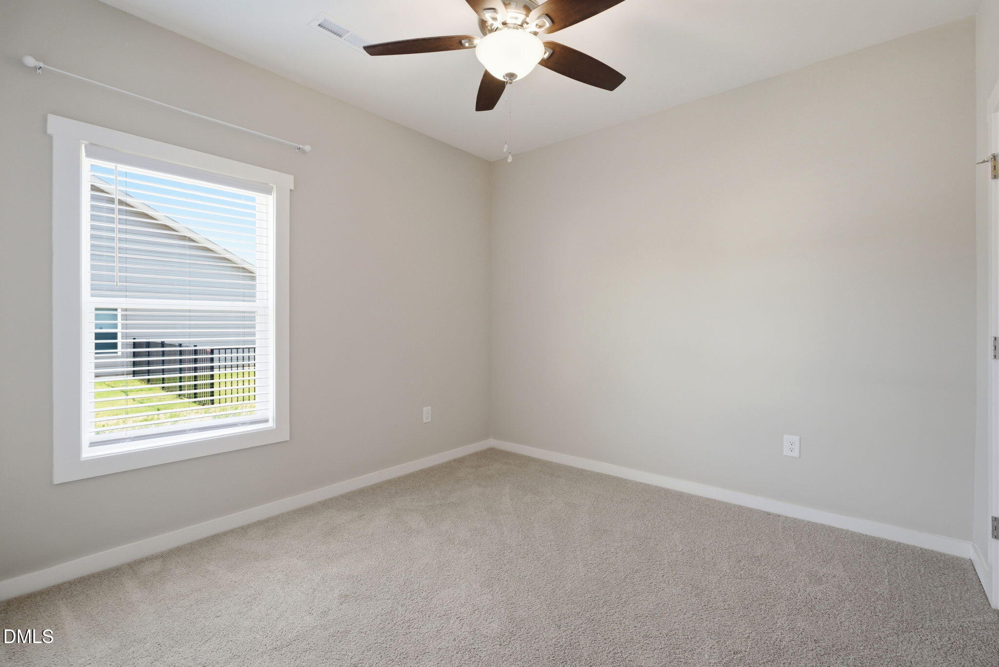 161 Tupelo Dr Spring Spring Hope, NC 27882 - Photo 21 of 28 an empty room with a window and a fan