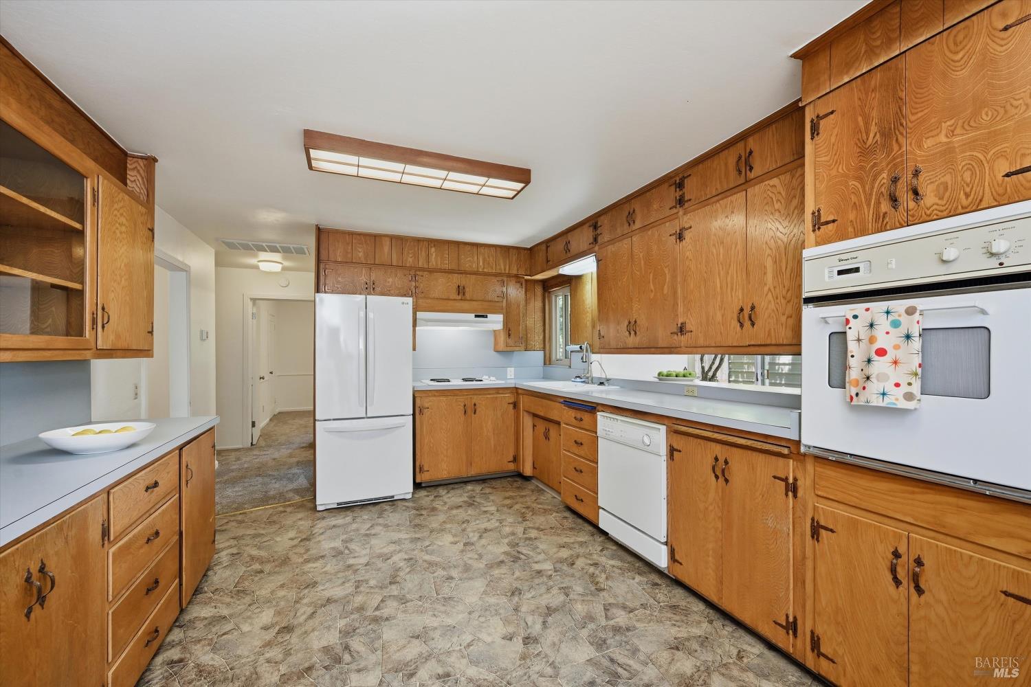 4941 Hansen Drive Santa Rosa, CA 95409 - Photo 9 of 35 Solid wood cabinets provide lots of storage space in this expansive kitchen