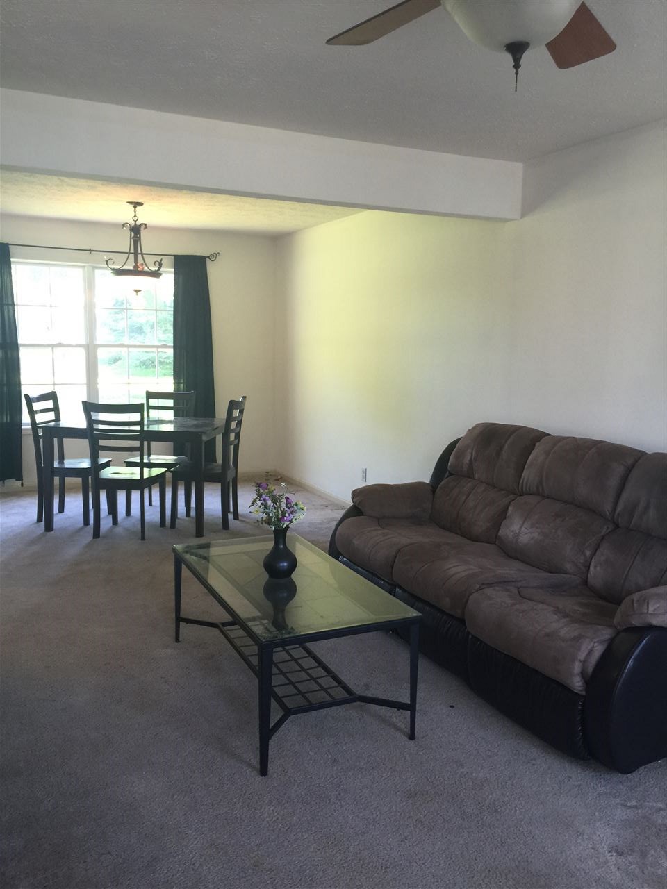 128 Pembroke Road Southwest Poplar Grove, IL 61065 - Photo 3 of 9 a living room with furniture and a large window
