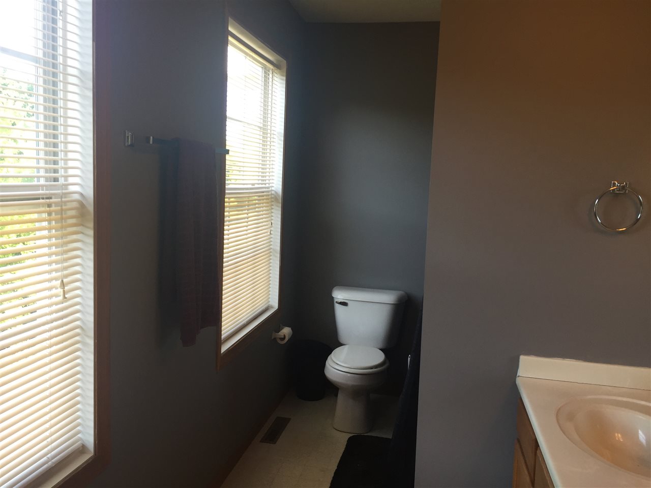 128 Pembroke Road Southwest Poplar Grove, IL 61065 - Photo 8 of 9 a white toilet sitting next to a window in a bathroom