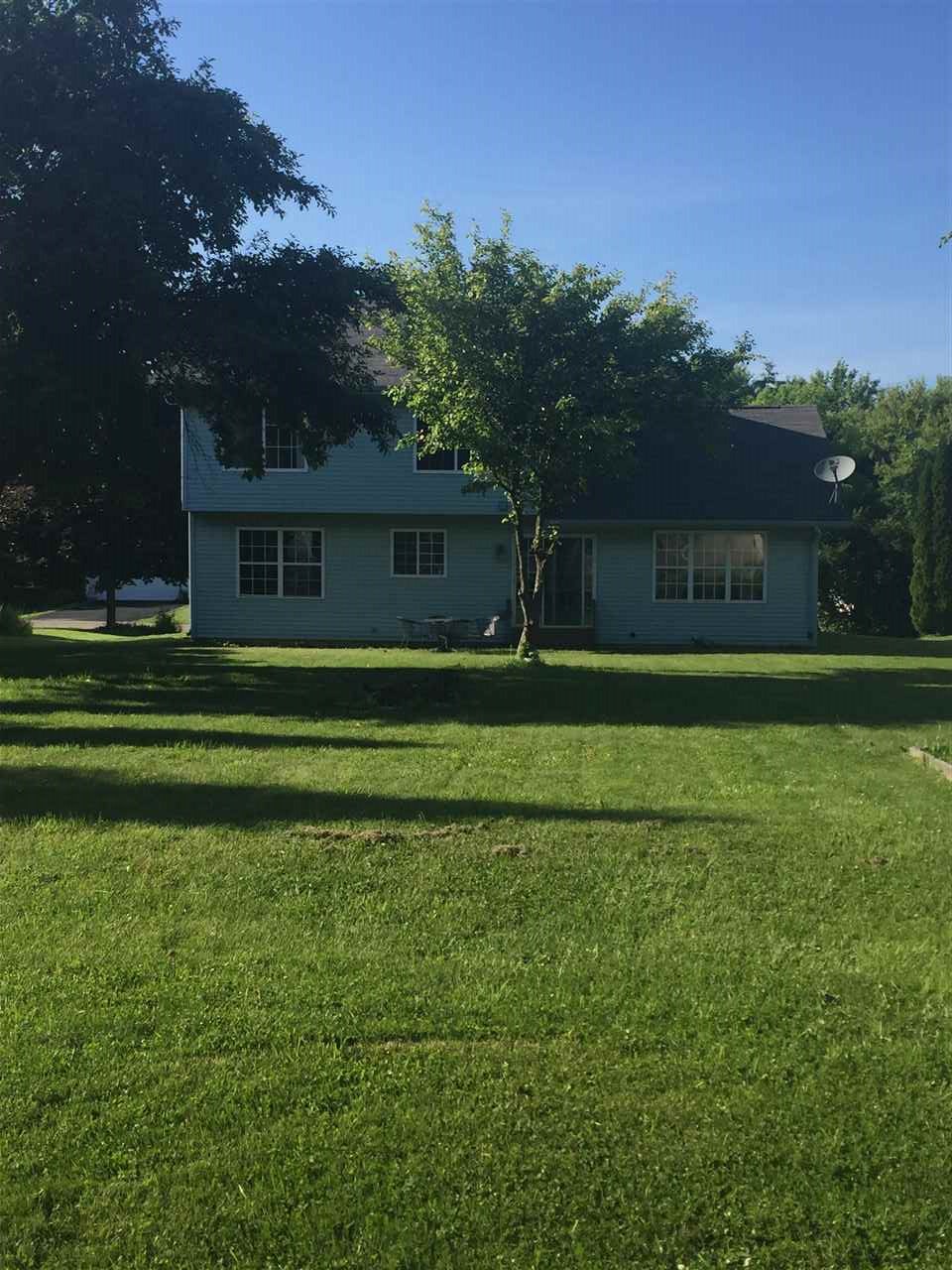 128 Pembroke Road Southwest Poplar Grove, IL 61065 - Photo 9 of 9 a front view of a house with a garden