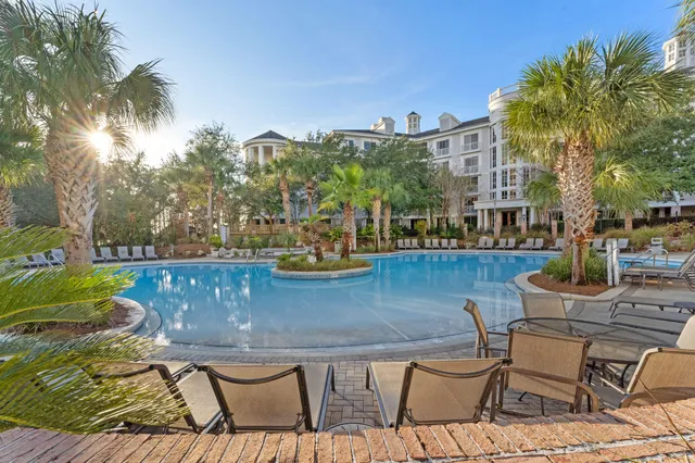 a view of a chairs and table in patio