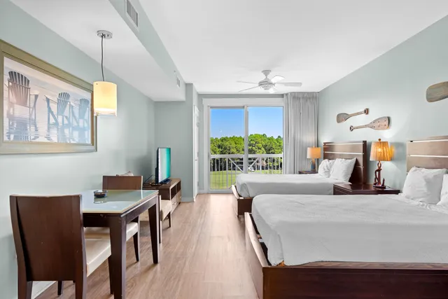 a bedroom with a bed and a table