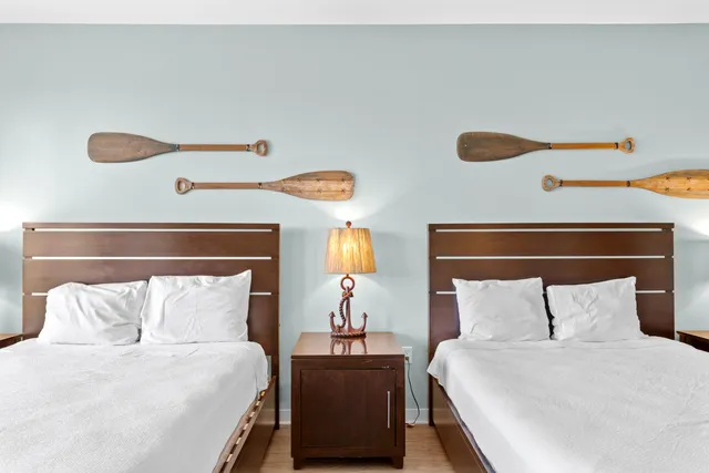 a bedroom with a bed and a lamp