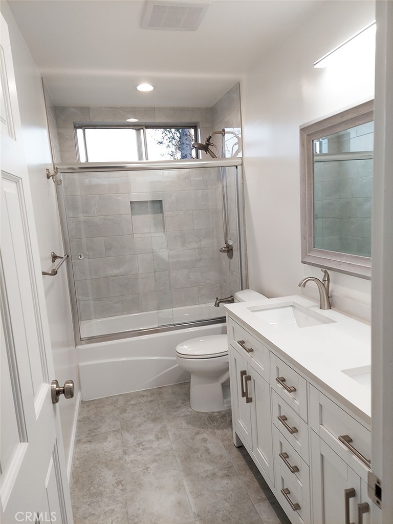 3921 Declaration Avenue Calabasas, CA 91302 - Photo 11 of 26 a bathroom with a double vanity sink toilet and shower