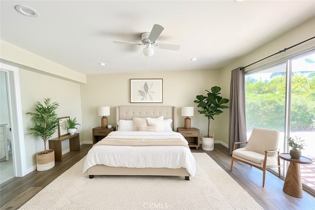 3921 Declaration Avenue Calabasas, CA 91302 - Photo 12 of 26 a bedroom with a large bed and a potted plant
