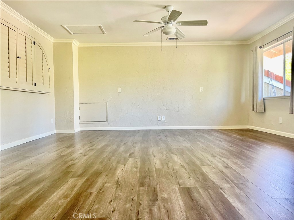 3921 Declaration Avenue Calabasas, CA 91302 - Photo 14 of 26 an empty room with wooden floor and windows
