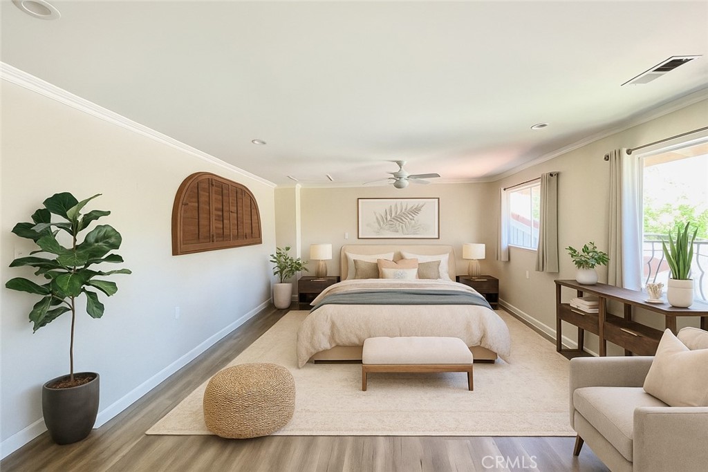 3921 Declaration Avenue Calabasas, CA 91302 - Photo 15 of 26 a bedroom with furniture and a potted plant