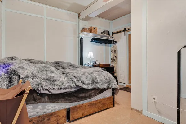 a bedroom with a bed and a closet