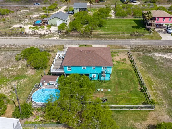 an aerial view of a house with outdoor space
