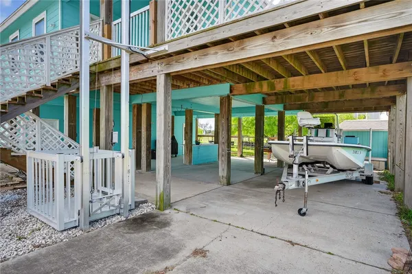 a view of a patio with a table and chairs