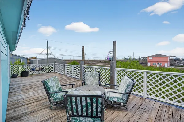a view of a balcony with furniture