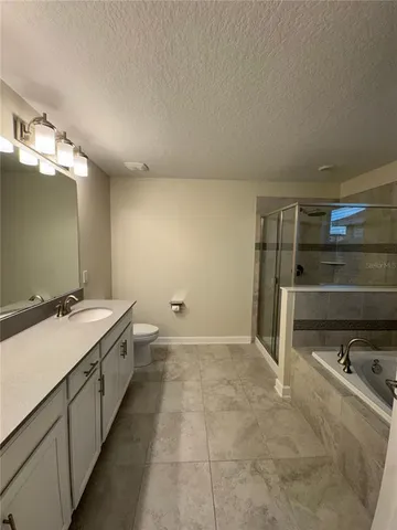 an empty room with a window and a fireplace