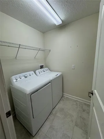 a bathroom with a granite countertop sink toilet a mirror and shower