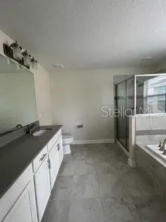a bathroom with a tub and a shower
