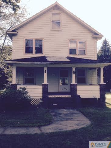 1563 Englishtown Road Old Bridge, NJ 08857 - Photo 14 of 15 a front view of a house with a garden and yard