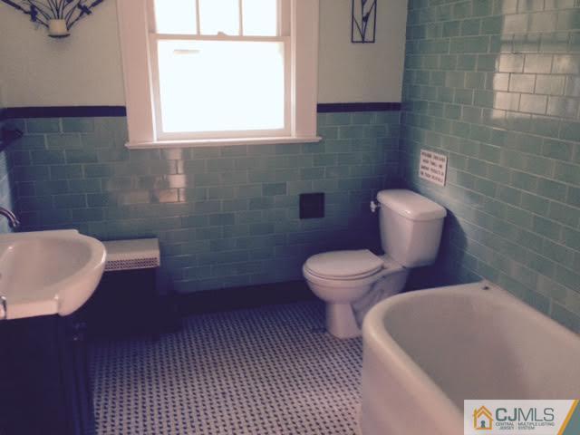1563 Englishtown Road Old Bridge, NJ 08857 - Photo 5 of 15 a bathroom with a toilet and a sink