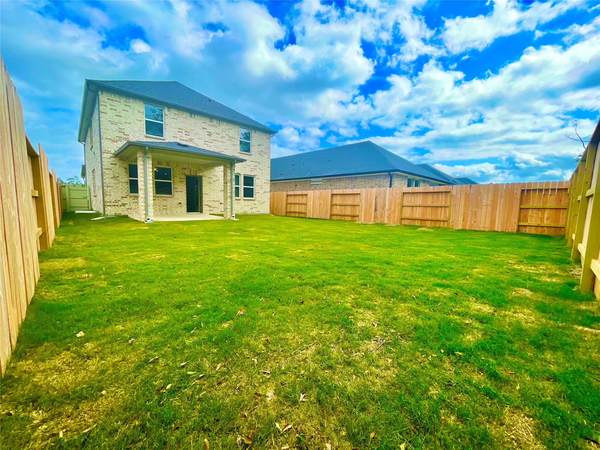 17526 Rosette Grass Conroe, TX 77385 - Photo 23 of 49 a view of a yard in front of a house