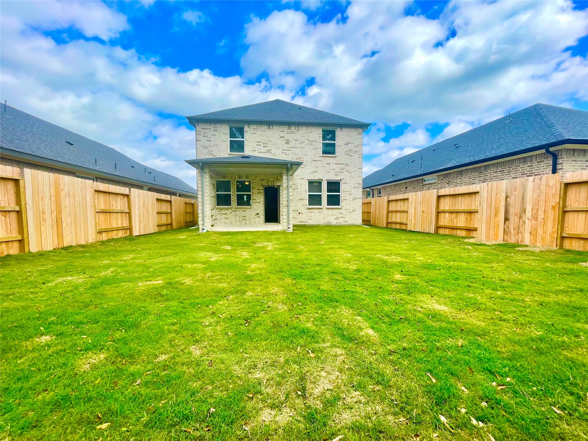 17526 Rosette Grass Conroe, TX 77385 - Photo 24 of 49 a view of a house with a big yard and large tree