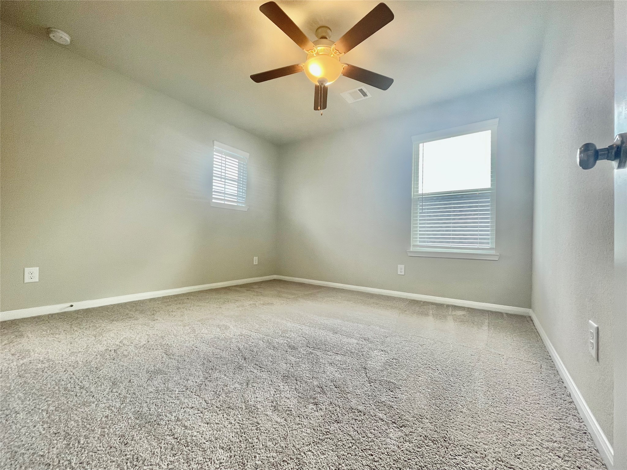 17526 Rosette Grass Conroe, TX 77385 - Photo 29 of 49 an empty room with a window and a fan