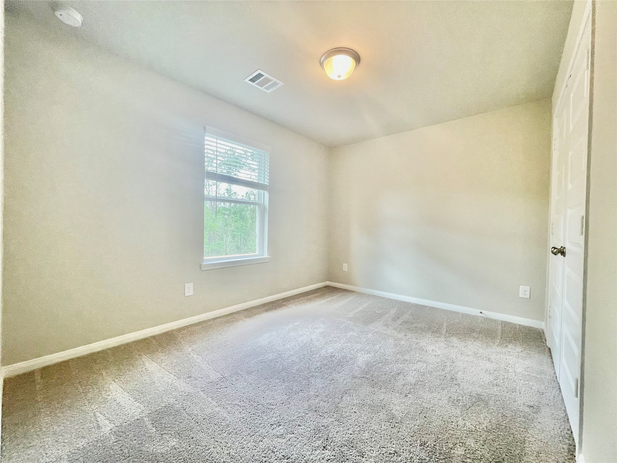 17526 Rosette Grass Conroe, TX 77385 - Photo 33 of 49 an empty room with a window