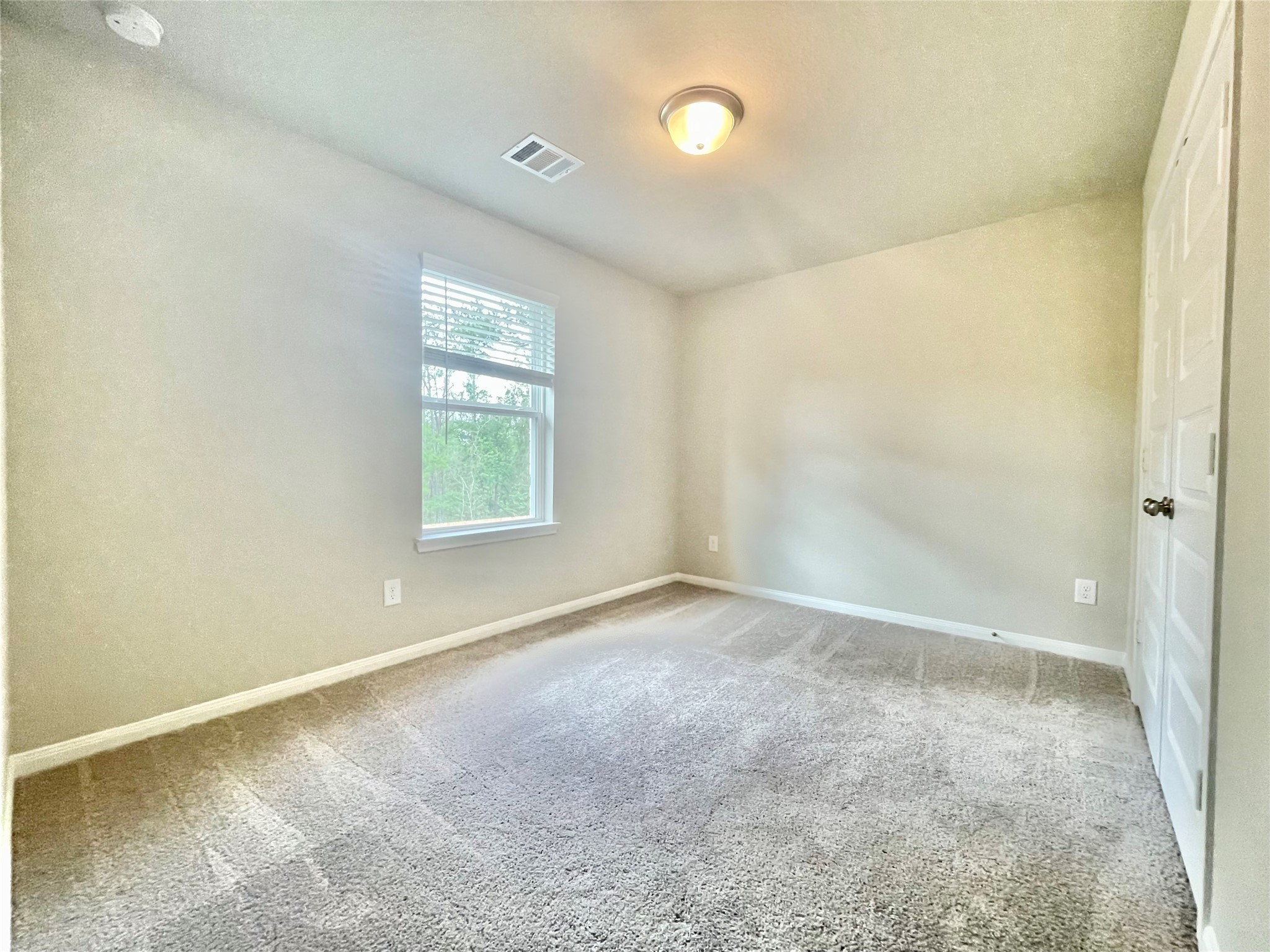17526 Rosette Grass Conroe, TX 77385 - Photo 34 of 49 an empty room with a window