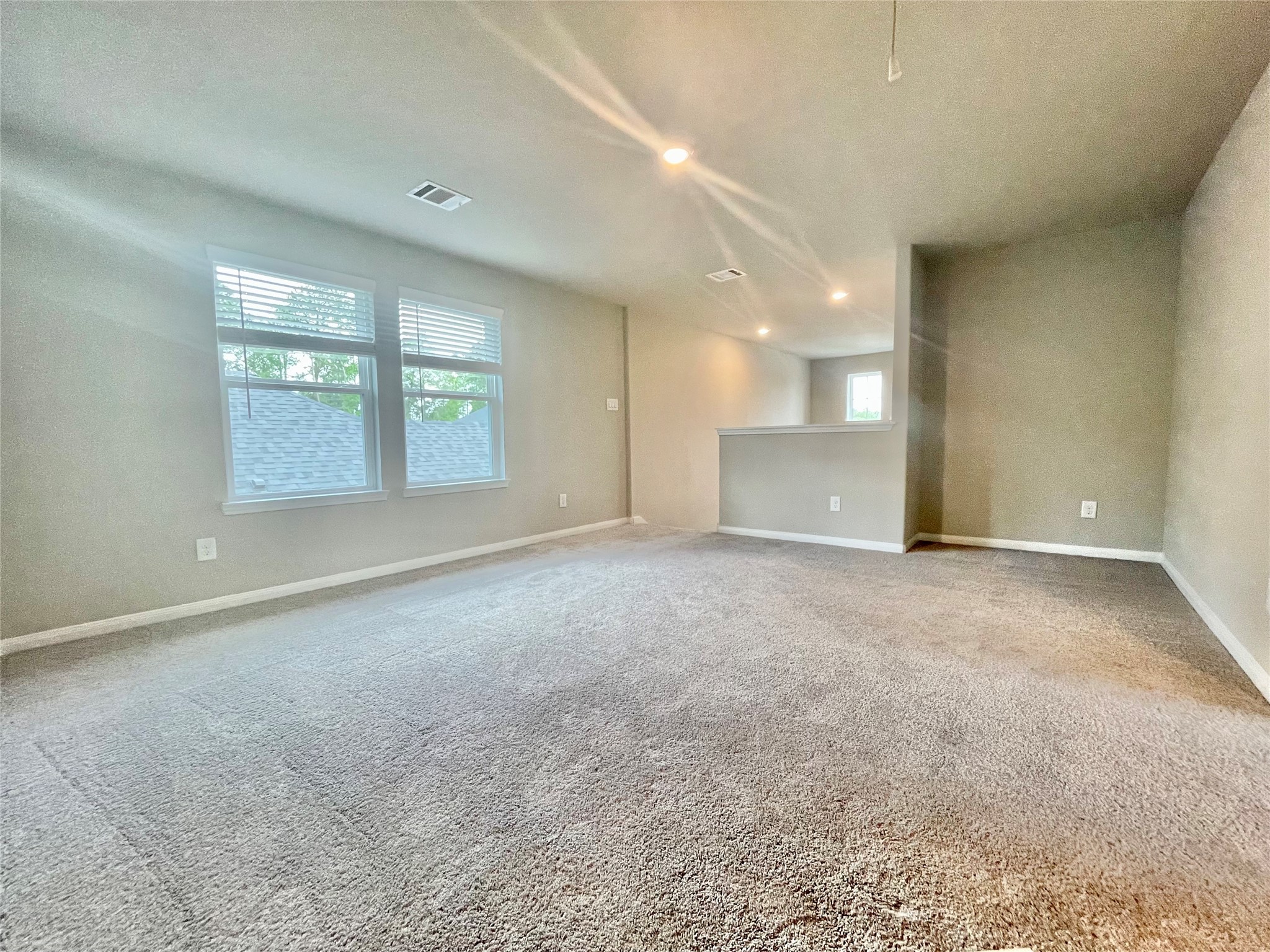 17526 Rosette Grass Conroe, TX 77385 - Photo 36 of 49 a view of an empty room with a window