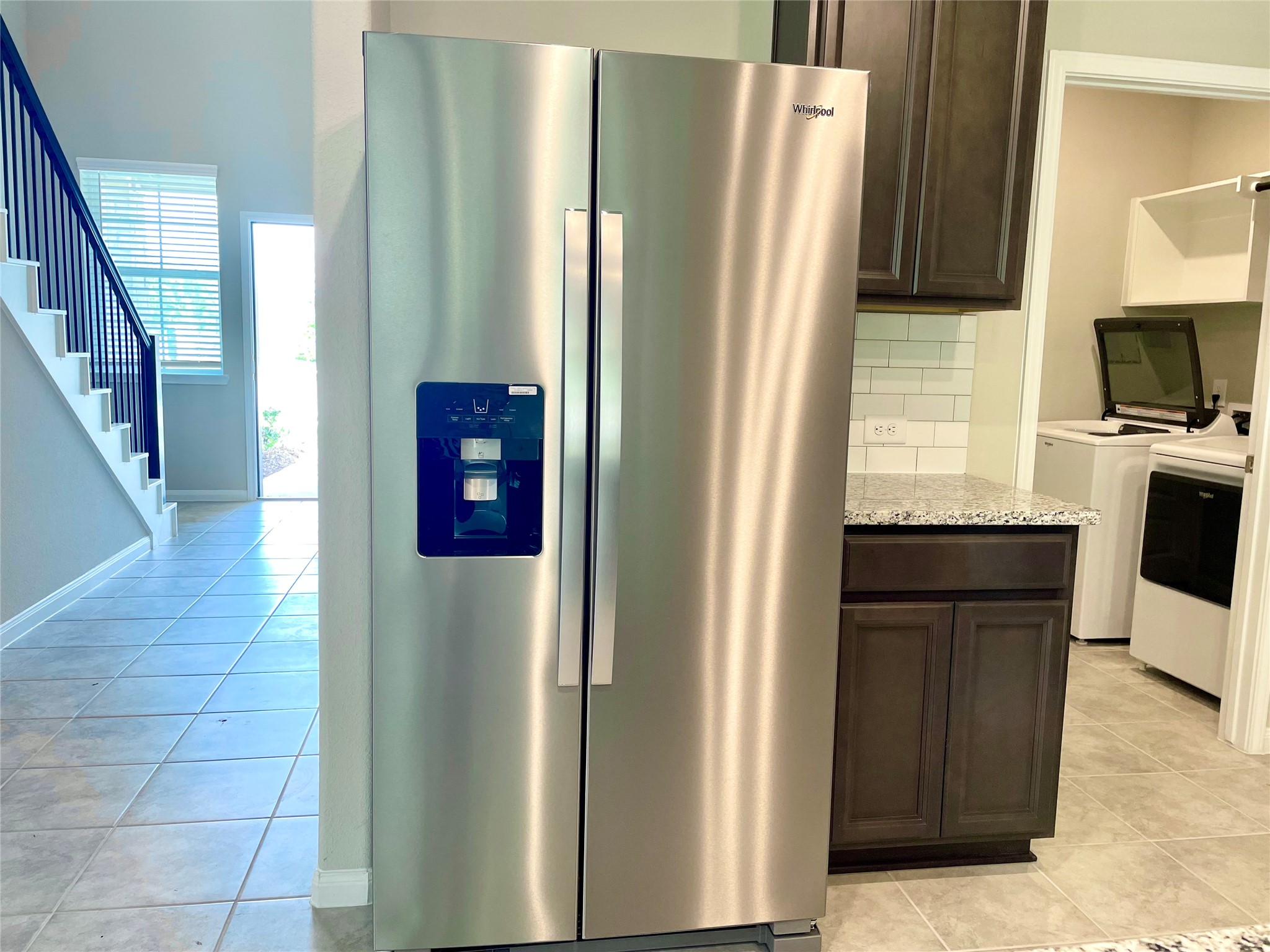 17526 Rosette Grass Conroe, TX 77385 - Photo 40 of 49 a kitchen with stainless steel appliances granite countertop a refrigerator and a sink