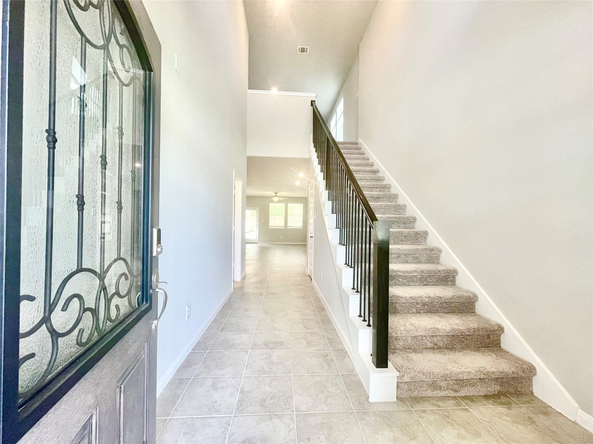 17526 Rosette Grass Conroe, TX 77385 - Photo 5 of 49 a view of a hallway with staircase