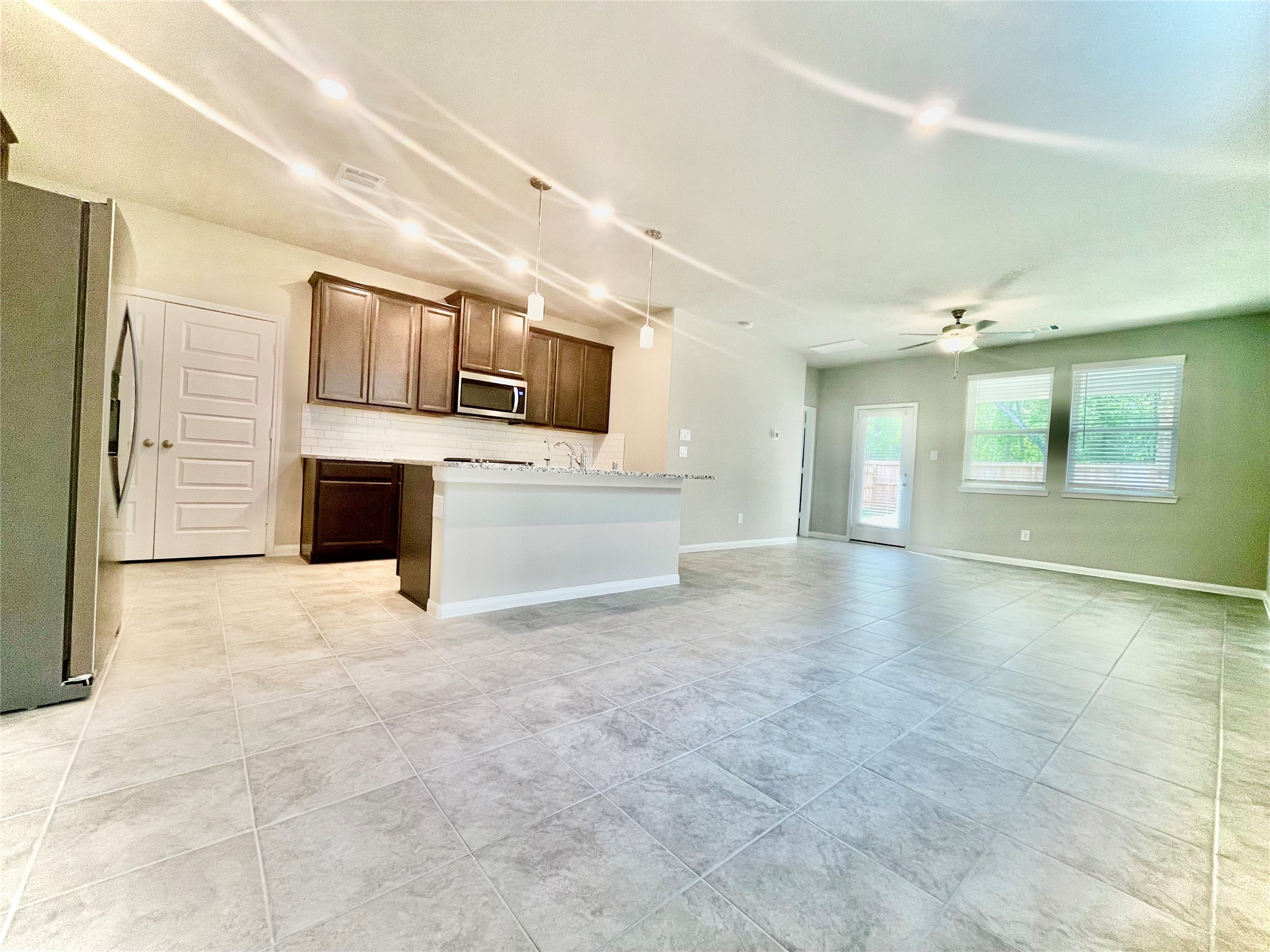 17526 Rosette Grass Conroe, TX 77385 - Photo 7 of 49 a view of kitchen with stainless steel appliances cabinets