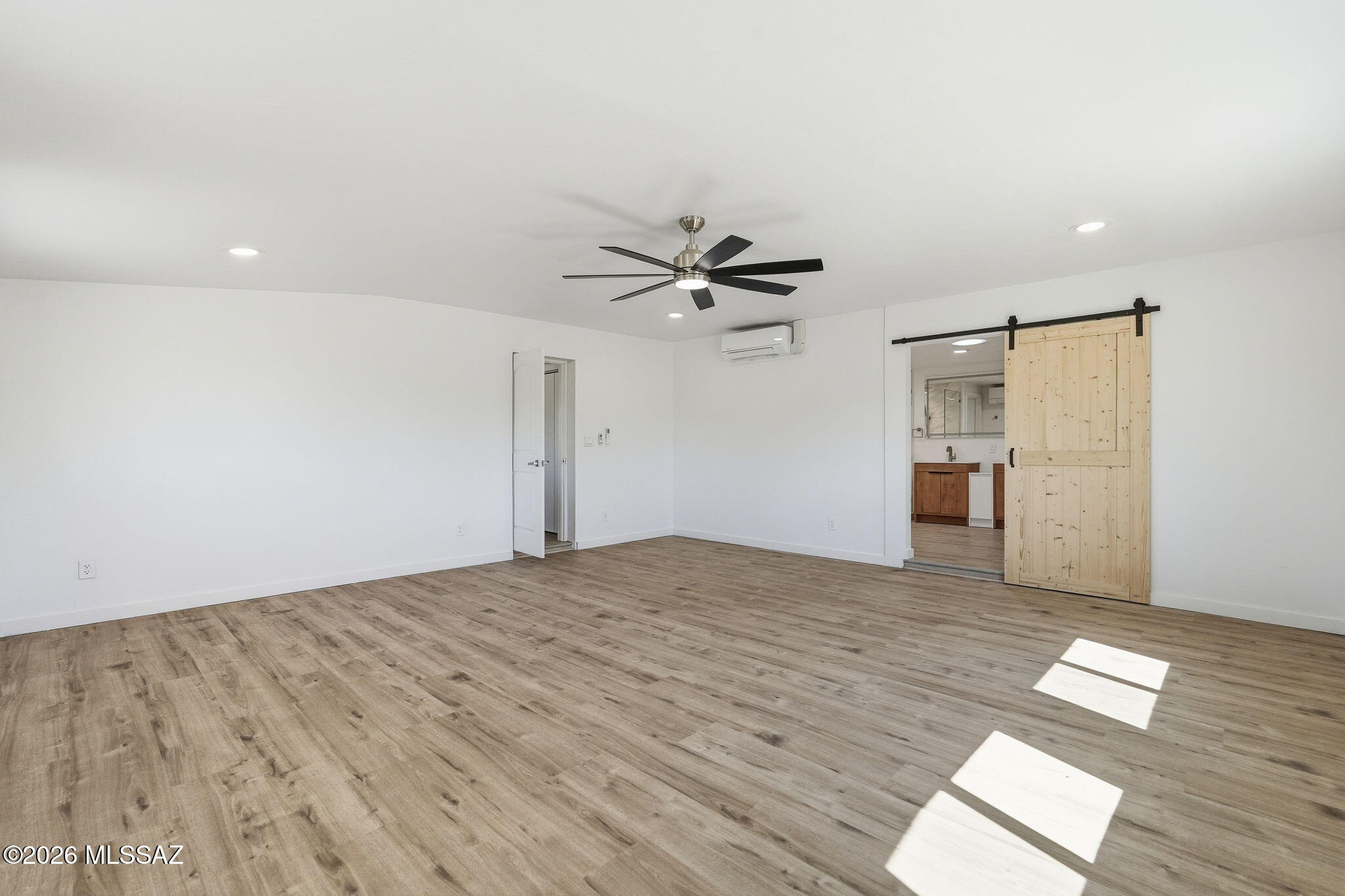 950 West Ina Road Tucson, AZ 85704 - Photo 15 of 54 a view of empty room with wooden floor and ceiling fan